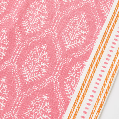 Peter Dunham pink cotton slub table runner with white Jaali floral block print and orange striped border.