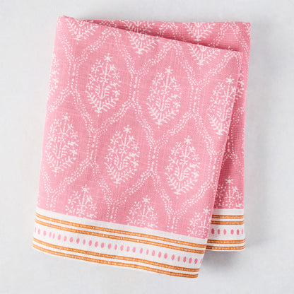 Pink Jaali Printed Tablecloth, 100% cotton slub, with white floral pattern and orange striped border.
