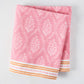 Pink Jaali Printed Tablecloth, 100% cotton slub, with white floral pattern and orange striped border.