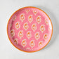 Peter Dunham + Hudson Grace Pink Janpath Melamine Salad Plate with orange paisley and flower pattern.