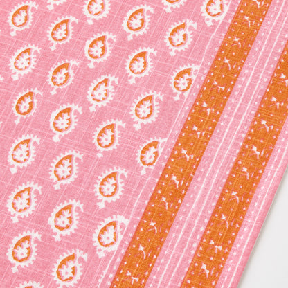 Pink cotton slub table runner with orange paisley print and graphic border detail by Peter Dunham + Hudson Grace.