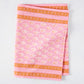 Pink Janpath Printed Table Runner, 100% cotton slub, with orange graphic border and small paisley pattern.