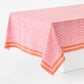 Pink cotton slub rectangular tablecloth with paisley print and orange graphic border by Peter Dunham + Hudson Grace.