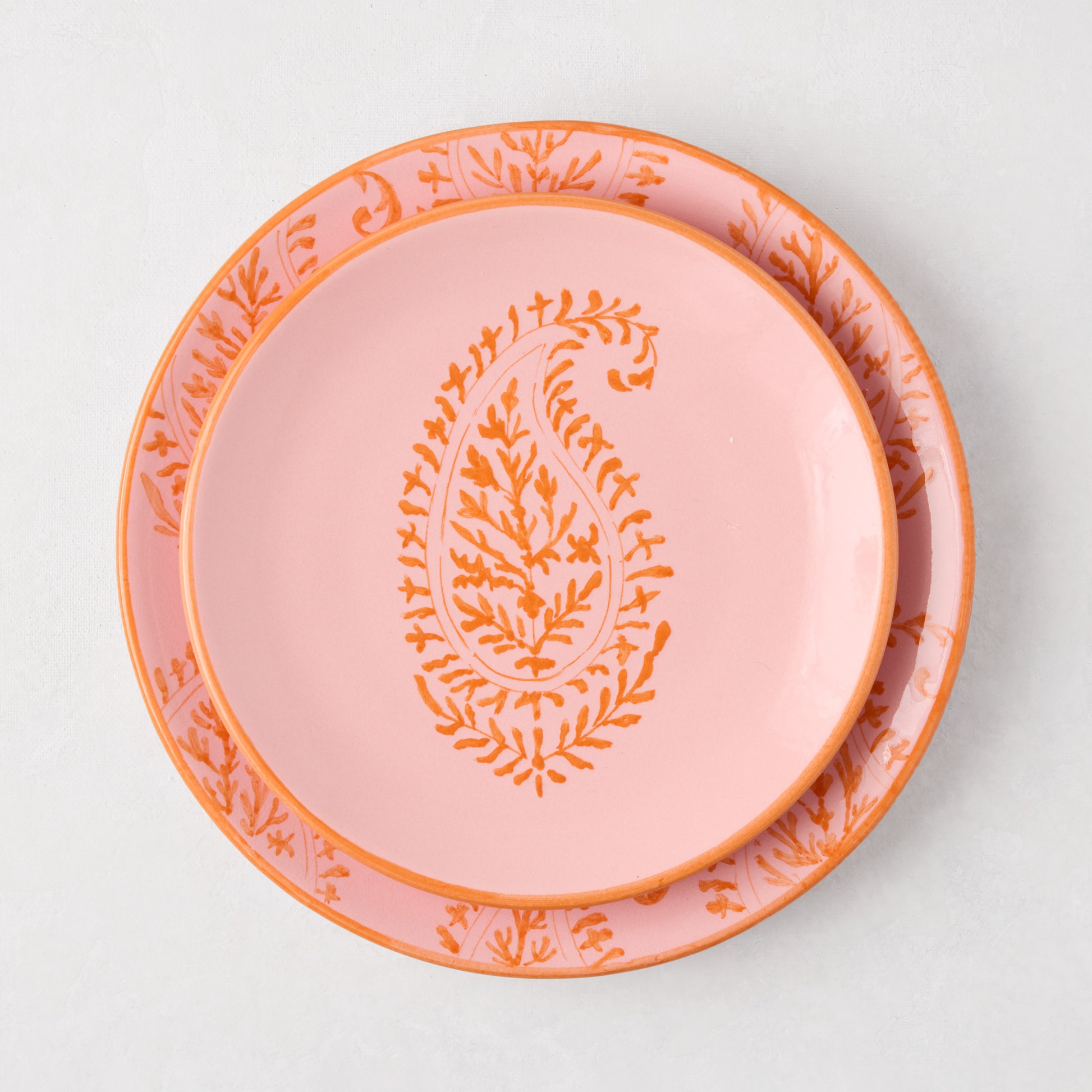 Peter Dunham + Hudson Grace Pink Kashmir hand-painted paisley salad plate with orange design.