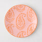 Pink Kashmir hand-painted paisley salad plate with orange design and rim.