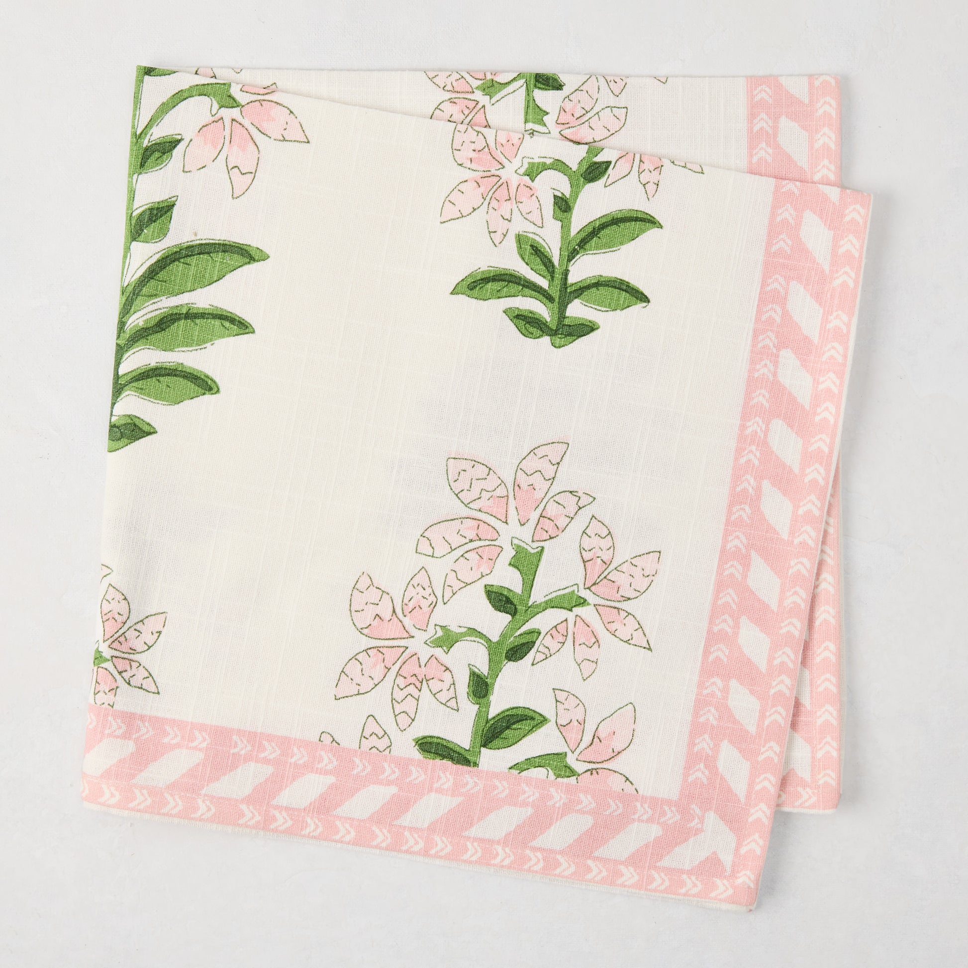 Peter Dunham + Hudson Grace Pink Shani Floral Printed Napkin, 100% cotton slub with pink botanical pattern and border.