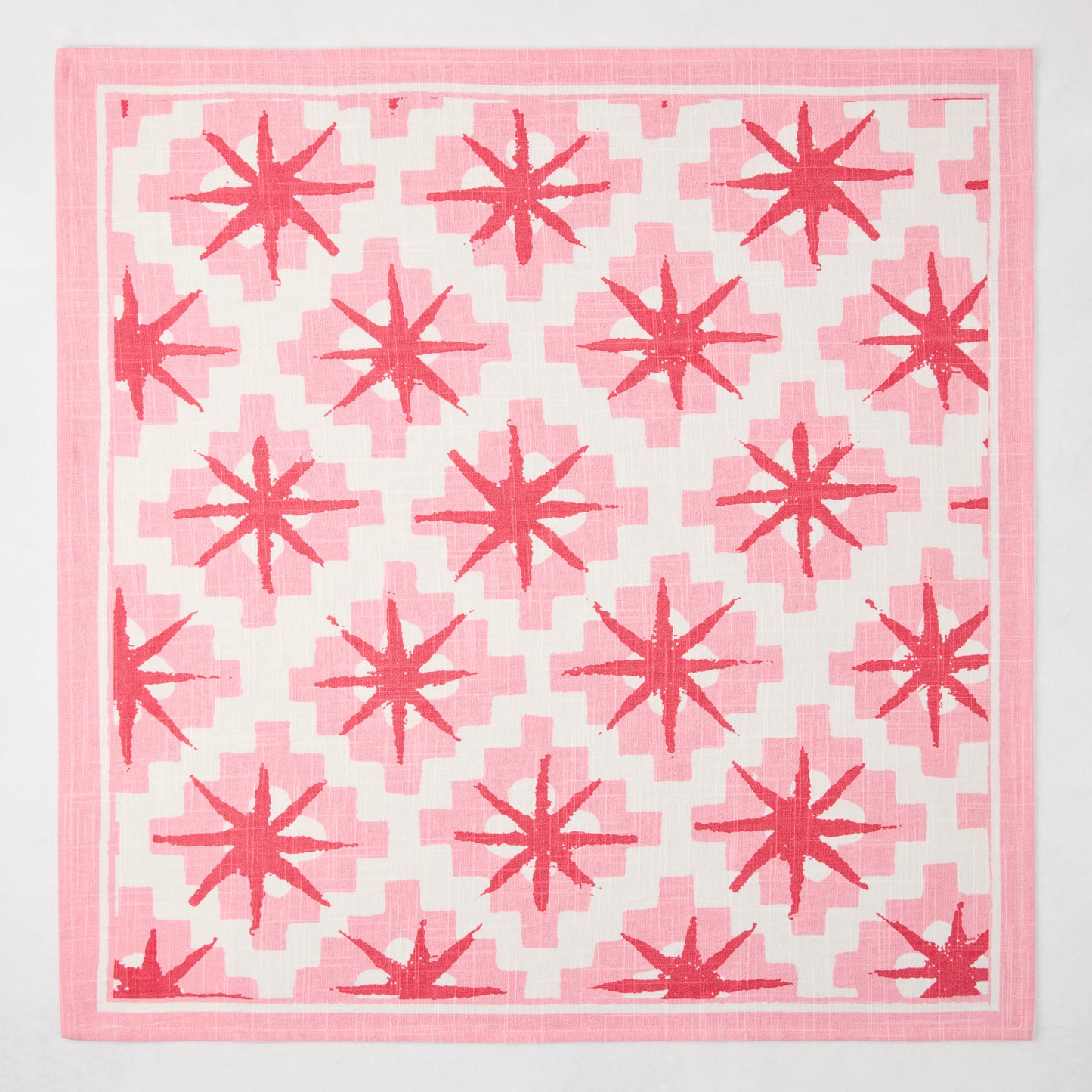 Peter Dunham + Hudson Grace Pink Starburst Printed Napkin, 100% cotton slub with red starburst pattern.