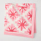 Peter Dunham + Hudson Grace Pink Starburst Printed Napkin, 100% cotton slub, folded.