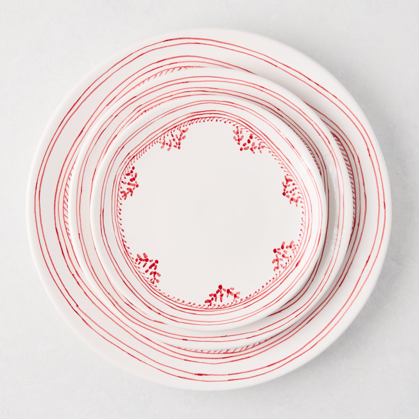 Peter Dunham + Hudson Grace Red Fez hand-painted border salad plate, white with red striped and dotted design.