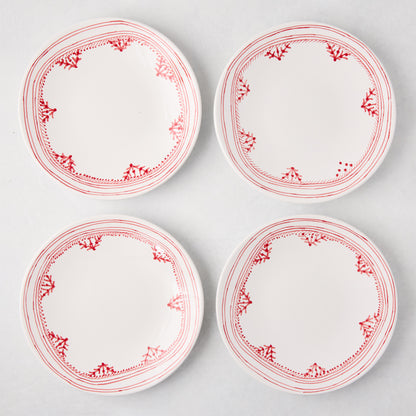 Four white Peter Dunham + Hudson Grace Red Fez salad plates with hand-painted red borders.