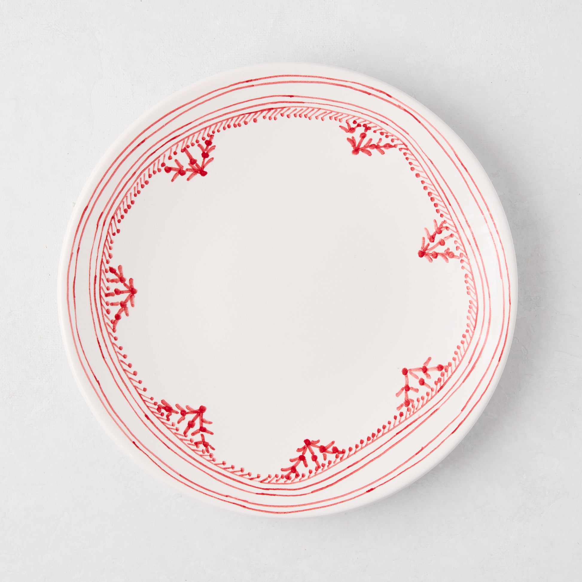 Peter Dunham + Hudson Grace Red Fez salad plate, white ceramic with hand-painted red border pattern.