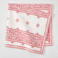 Peter Dunham + Hudson Grace Red Fez Stripe Printed Napkin, 100% cotton slub, folded, white with red vintage embroidery pattern.