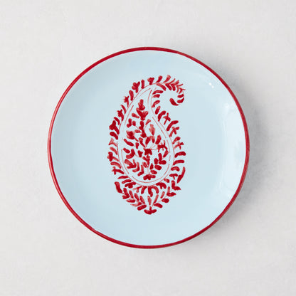 Peter Dunham + Hudson Grace Red Kashmir Paisley appetizer plate, hand-painted light blue ceramic with red trim.