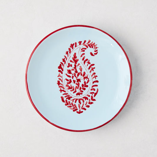 Peter Dunham + Hudson Grace Red Kashmir Paisley appetizer plate, hand-painted light blue ceramic with red trim.