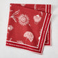 Red Indian Chintz cotton slub napkin with white floral print and dotted border.