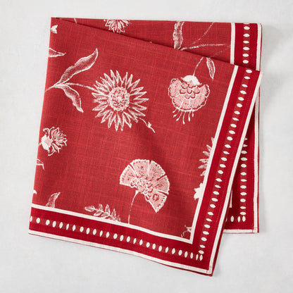 Red Indian Chintz cotton slub napkin with white floral print and dotted border.