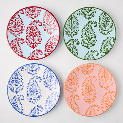 Four Peter Dunham + Hudson Grace Kashmir hand-painted paisley salad plates in red, green, blue, and orange.