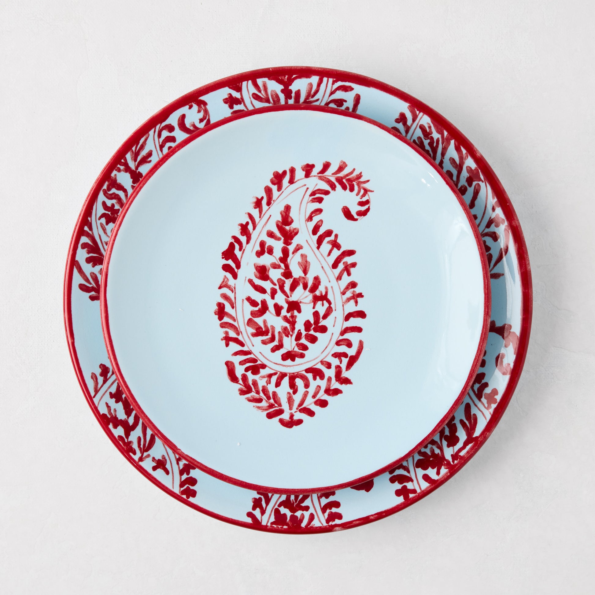 Peter Dunham + Hudson Grace Red Kashmir hand-painted paisley salad plate, light blue with red border and center design.