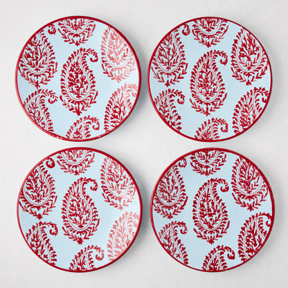 Four Peter Dunham + Hudson Grace Red Kashmir hand-painted paisley salad plates with light blue background.