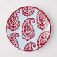 Peter Dunham + Hudson Grace Red Kashmir hand-painted paisley salad plate on light blue.