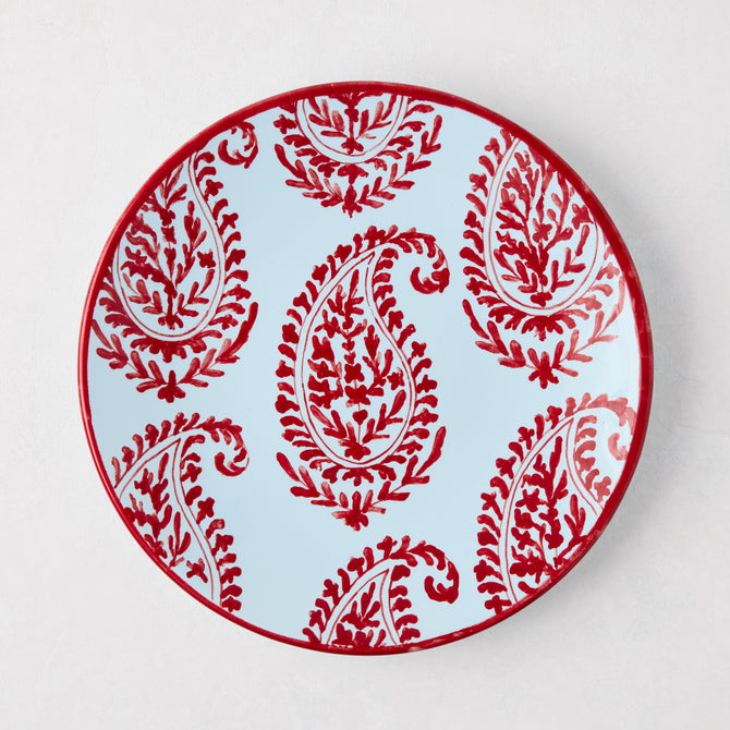 Peter Dunham + Hudson Grace Red Kashmir hand-painted paisley salad plate on light blue.