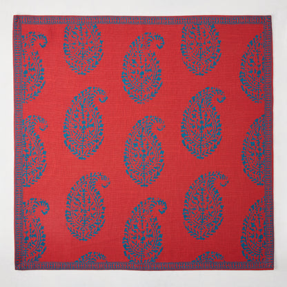 Red Kashmir Paisley Printed Napkin by Peter Dunham + Hudson Grace, featuring blue paisley pattern and border.