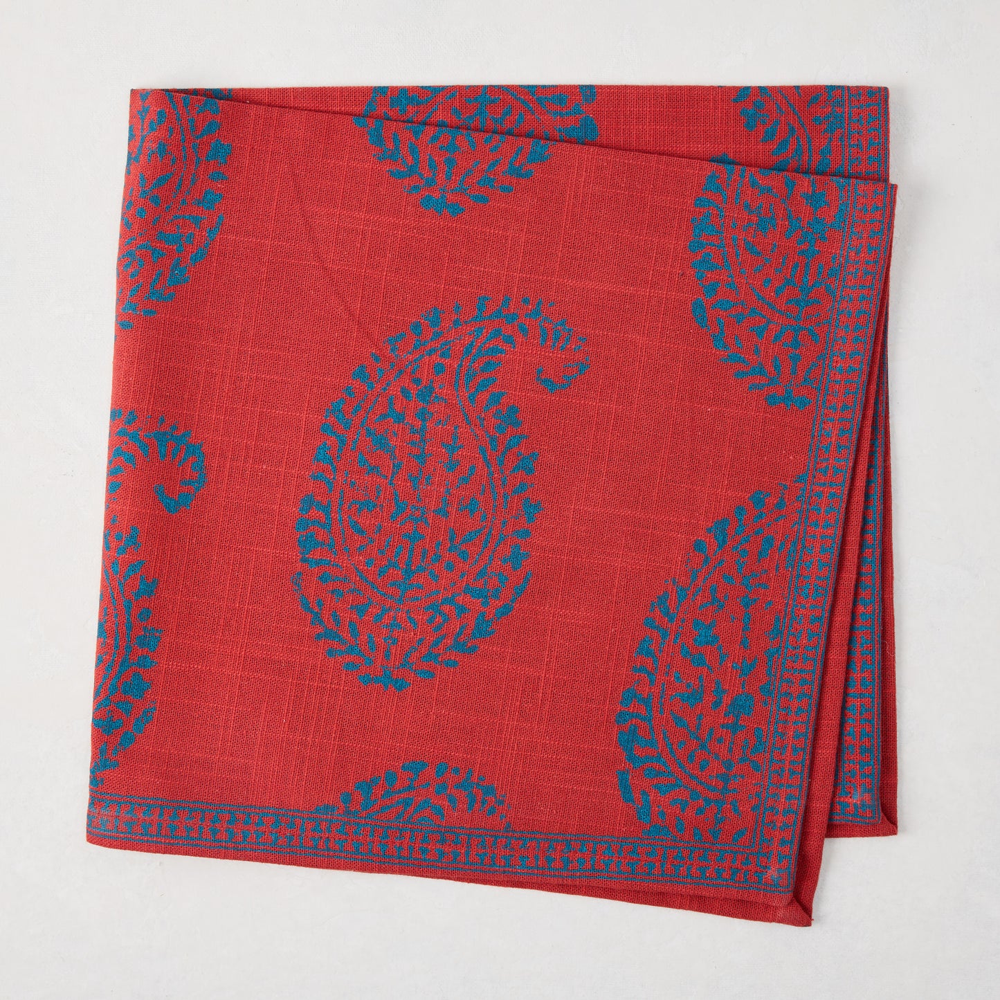 Peter Dunham + Hudson Grace Red Kashmir Paisley Printed Napkin with teal paisley design.