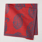 Red Kashmir Paisley Printed Napkin by Peter Dunham + Hudson Grace, folded with blue paisley pattern.