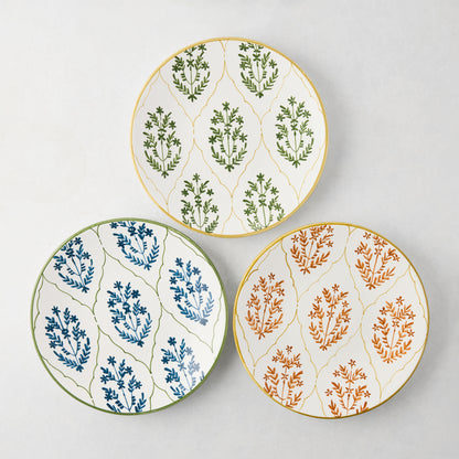 Three Peter Dunham + Hudson Grace Jaali salad plates: green, blue, and spice orange floral patterns.