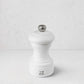 Peugeot Bistro 4" matte white wooden pepper mill with silver knob and logo.