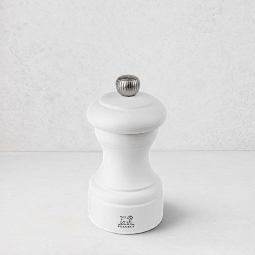 Peugeot Bistro 4" matte white wooden pepper mill with silver knob and logo.