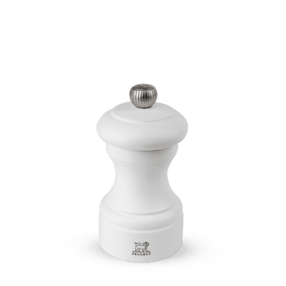 Peugeot Bistro 4" matte white wooden salt mill with a silver-toned finial.