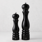 Peugeot Paris 9-inch salt and 12-inch pepper mills in glossy black lacquer finish with silver-tone metal knobs.