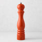 Peugeot Paris Exclusive 12" pepper mill in International Orange beechwood with a silver finial.