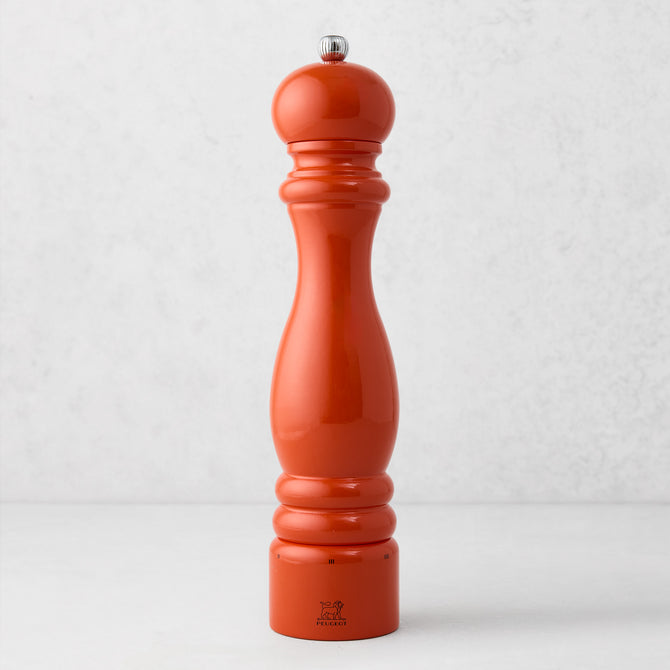 Peugeot Paris Exclusive 12" pepper mill in International Orange beechwood with a silver finial.