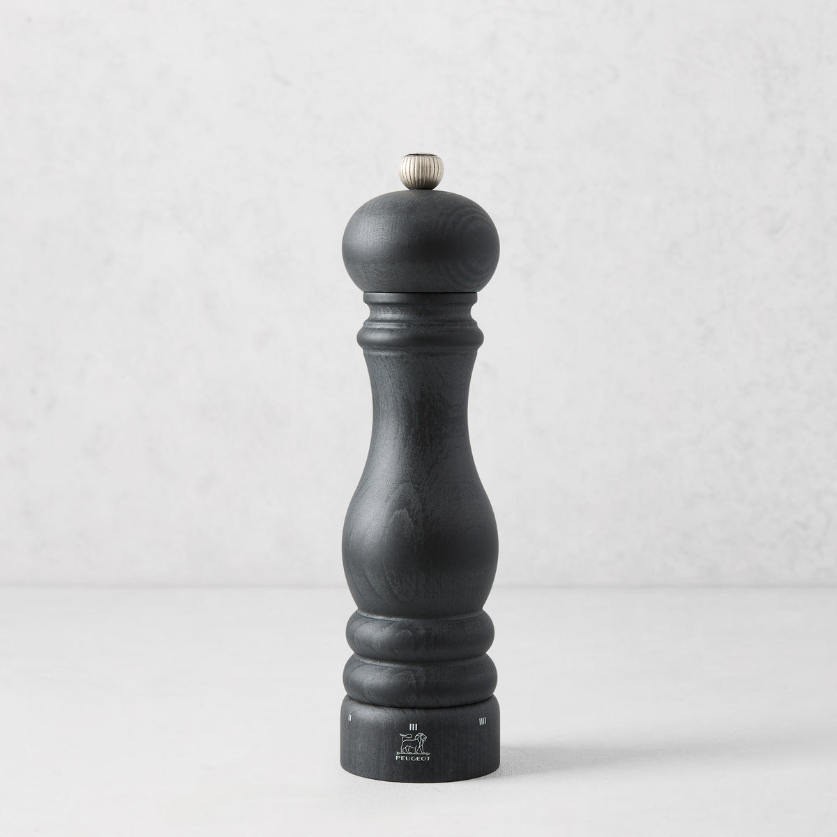 9-inch Peugeot Paris pepper mill in matte black wood with a stainless steel adjustment knob.