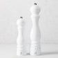 Peugeot Paris 9-inch salt and 12-inch pepper mills in white glossy lacquer finish with chrome knobs.