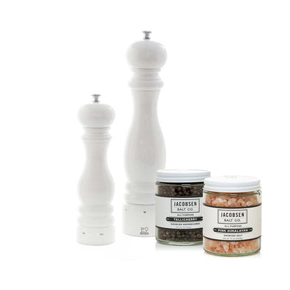 Peugeot Paris white lacquer wood salt and pepper mills with Jacobsen Tellicherry peppercorns and pink Himalayan salt.
