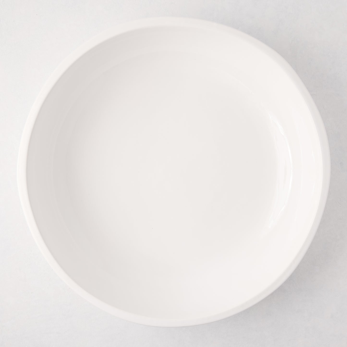 Large, round, white ceramic Piatto Riso serve bowl with a smooth, glazed finish.