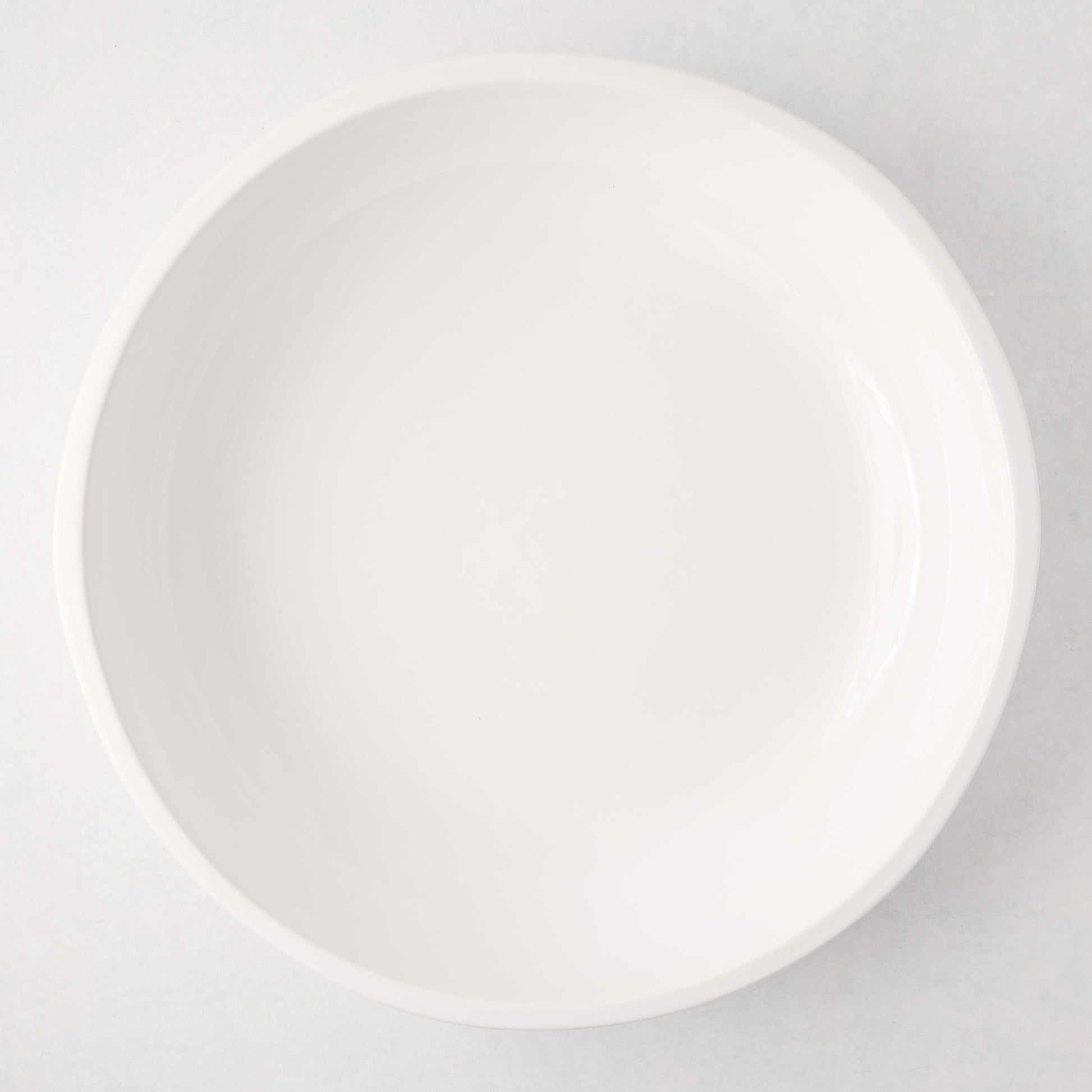 Large, round, white ceramic Piatto Riso serve bowl with a smooth, glazed finish.