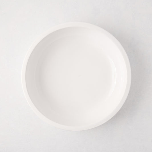 White ceramic Piatto Riso Small Serve Bowl, 11.75"Dia x 3"H, with a simple, sleek design.
