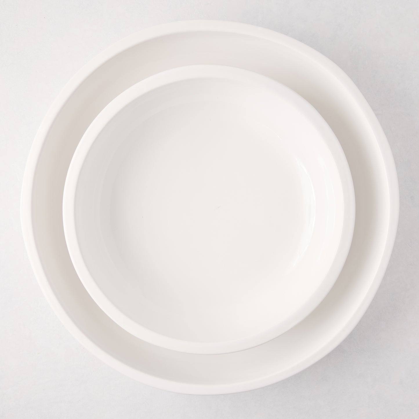 White ceramic Piatto Riso small serve bowl, 11.75"Dia x 3"H, with a clean, simple design.
