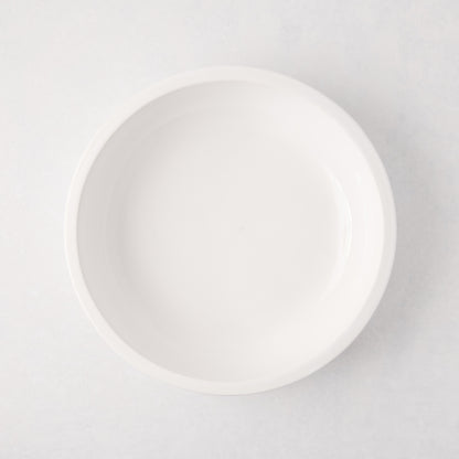 White ceramic Piatto Riso Small Serve Bowl, 11.75"Dia x 3"H, with a simple, sleek design.