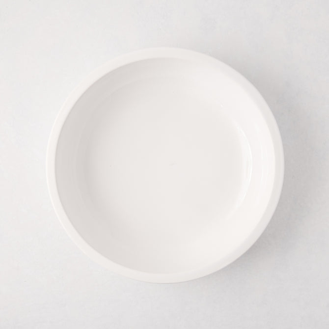 White ceramic Piatto Riso Small Serve Bowl, 11.75"Dia x 3"H, with a simple, sleek design.