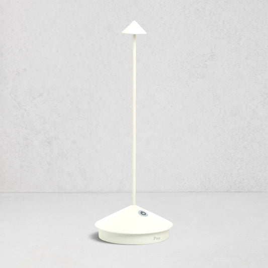 White die-cast aluminum Pina Pro rechargeable LED table lamp with a broad base and thin rod.