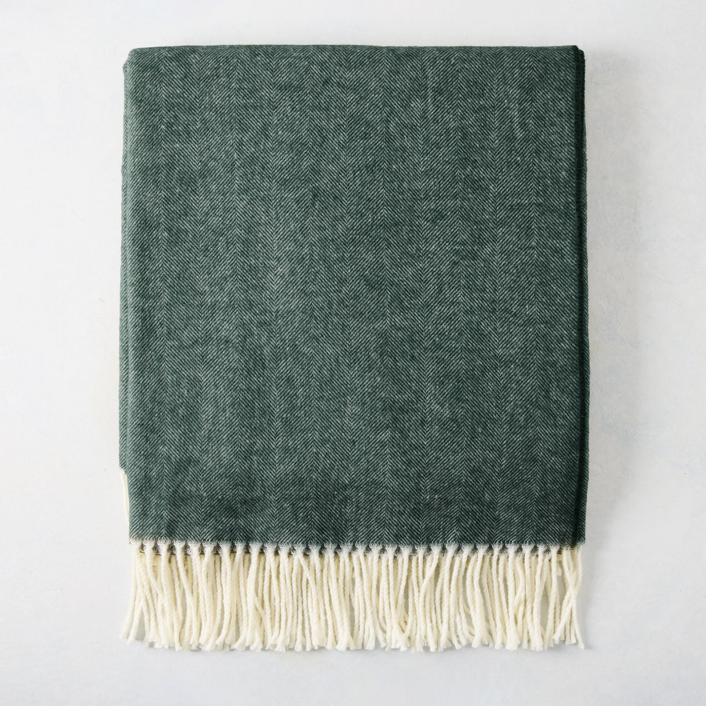 Pine Green Italian Herringbone Throw Blanket, 51"x67", with cream fringe.