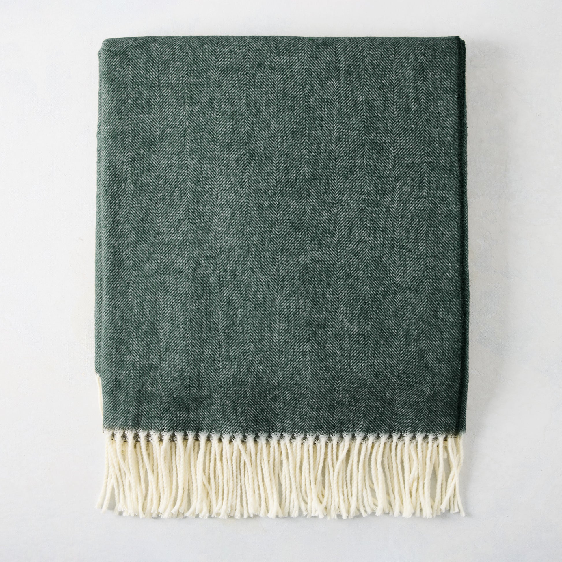 Pine Green Italian Herringbone Throw Blanket, 51"x67", with cream fringe.
