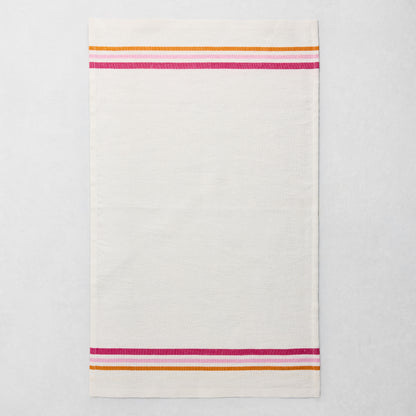 White cotton-linen hand towel with pink, orange, and fuchsia triple stripes at top and bottom.