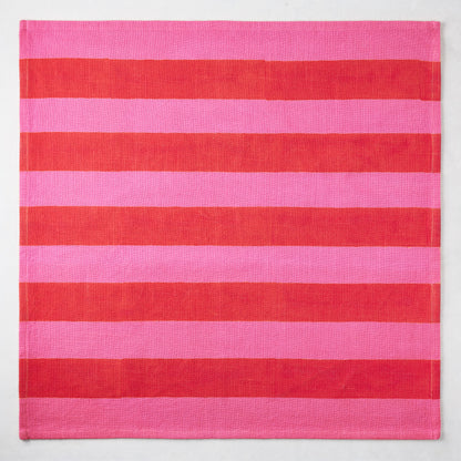 Pink and red tonal Hampton Stripe cotton napkin, 22" square.