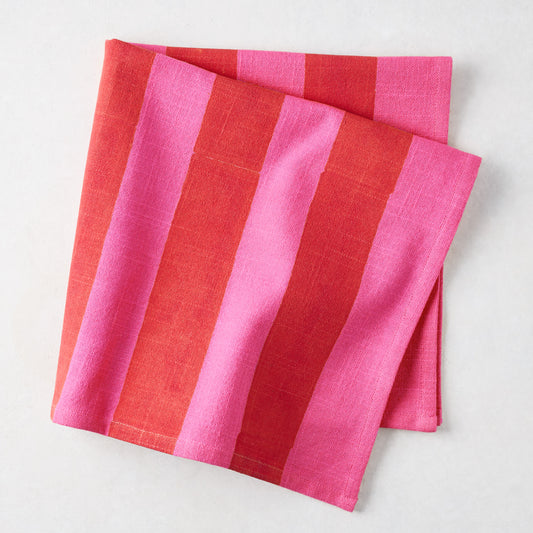 Folded Pink and Red Tonal Hampton Stripe Cotton Napkin, 22" square.